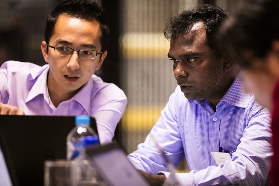 researchers working together on a computer