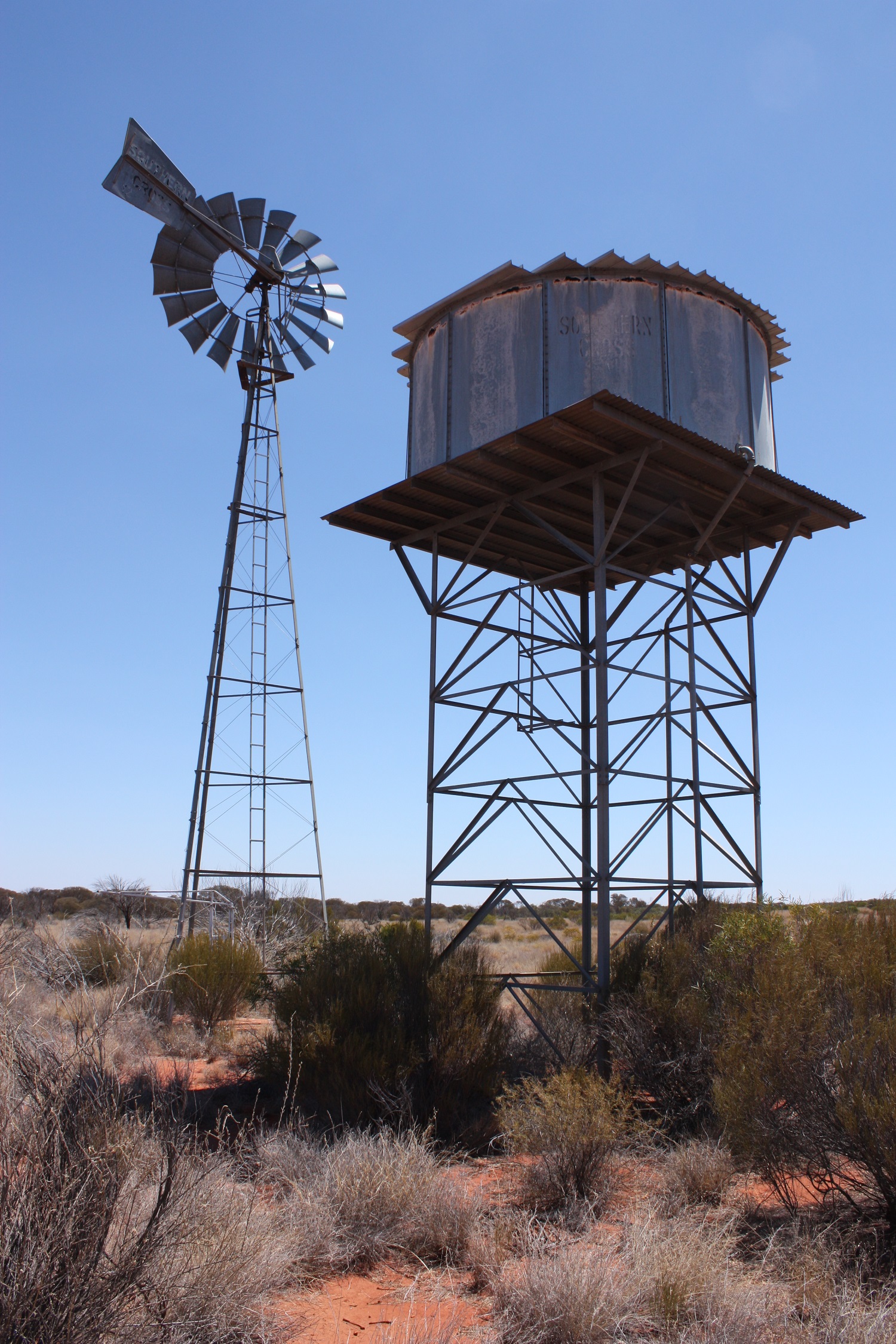 A picture of a windmill and water storage tank located in Musgrave Province South Australia.