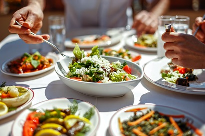 Table set with plates of bowls and food being served