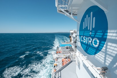 The side of a ship showing a large blue logo with an image of Australia and word 'CSIRO' on it.