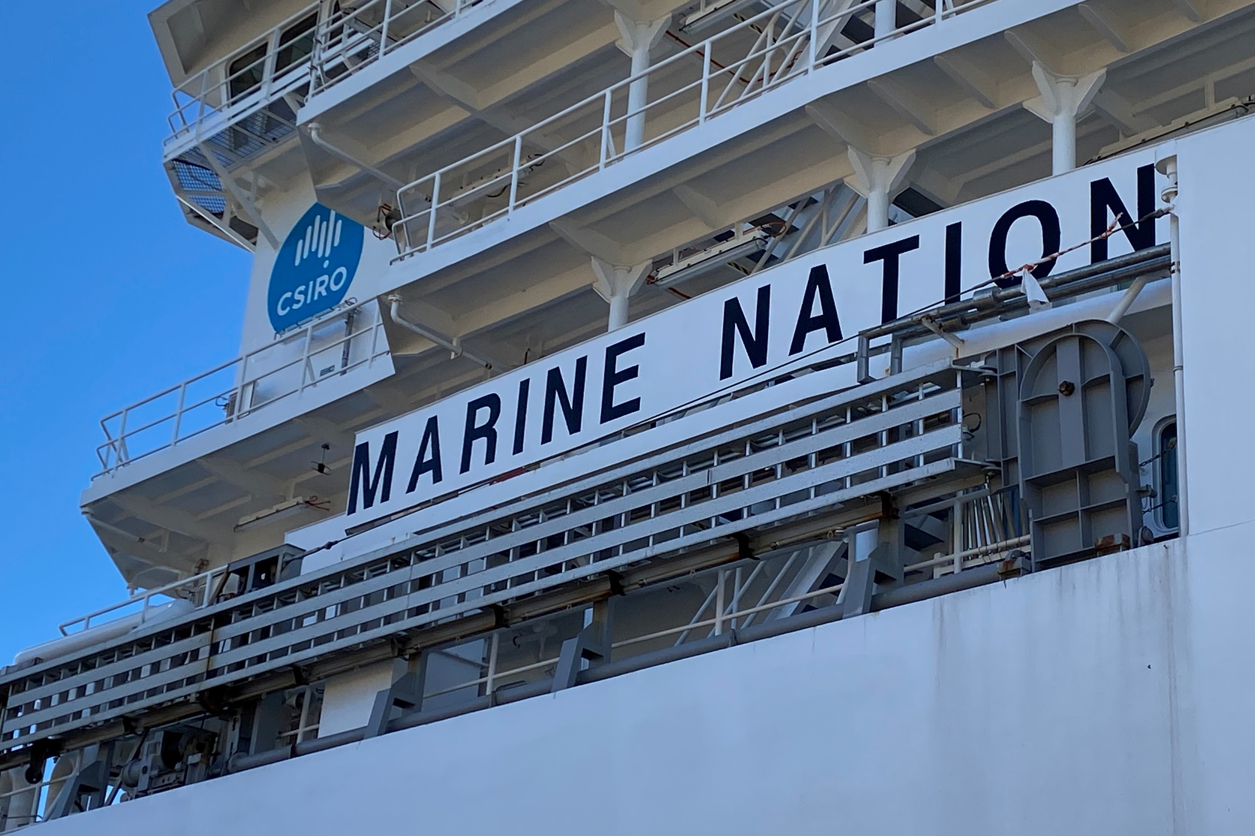 The side of a ship with a blue CSIRO logo on it and the words 'Marine Nation'.