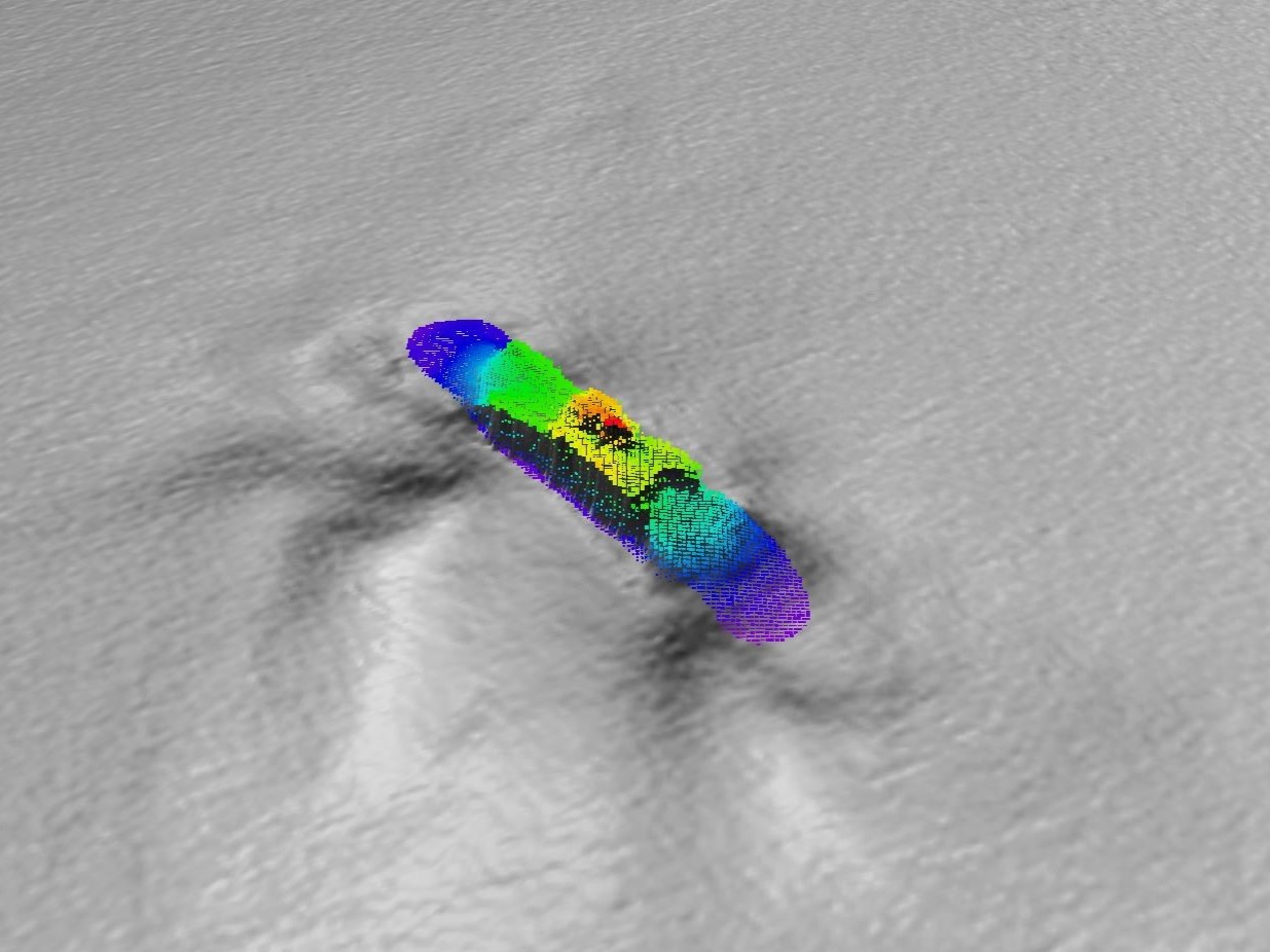 A colourful seafloor map showing the wreck of a ship.