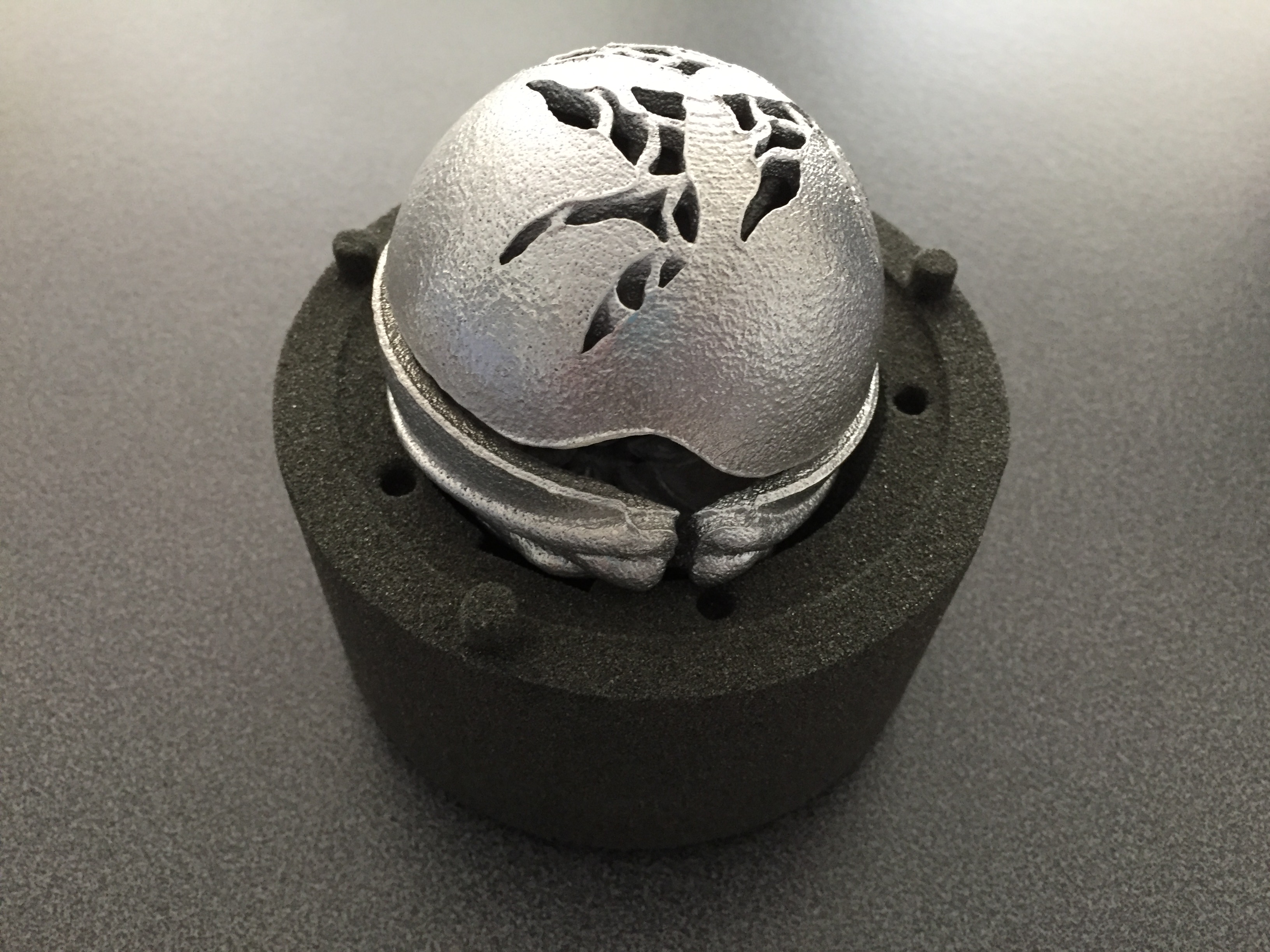 CSIRO Ball sitting on top of the sand mould casting.