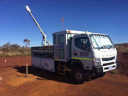 Truck next to exploration drilling rig 