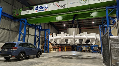 Industrial hanger with car in foreground