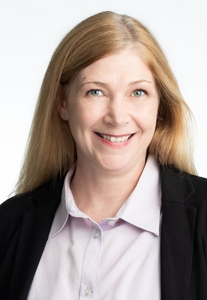 Smiling woman with red-blonde long hair