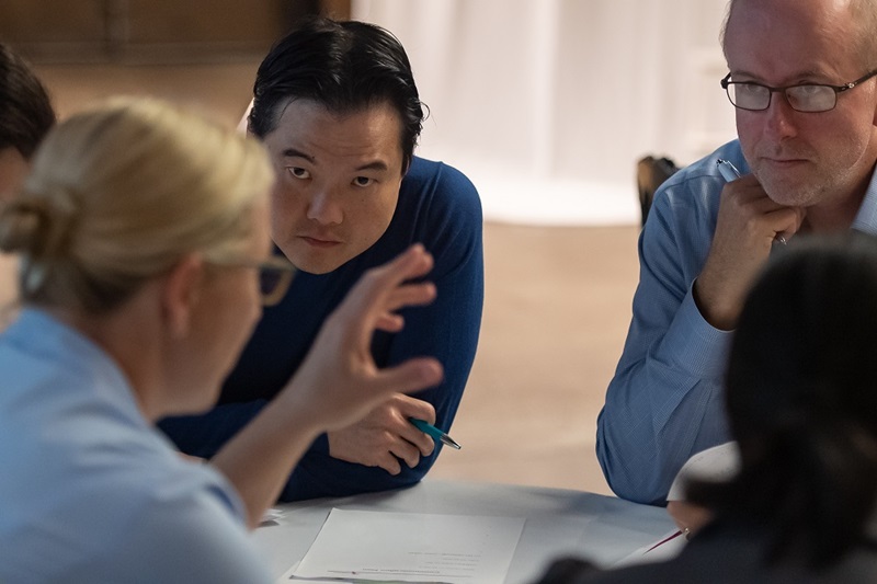 two females and two males in discussion