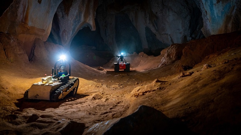 two robots in a cave