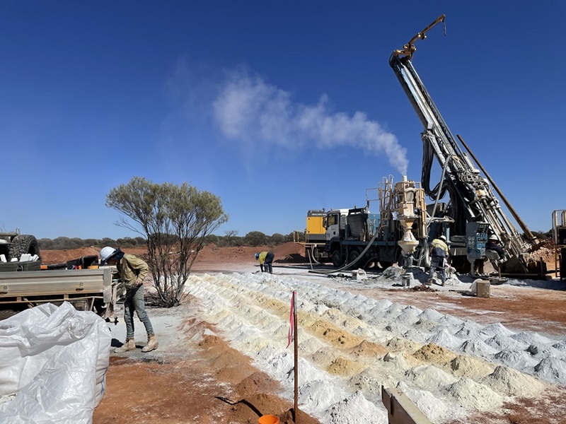 Piles of sand samples in a field