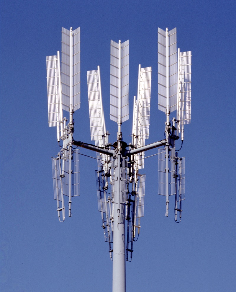 a mobile phone tower against a blue sky background