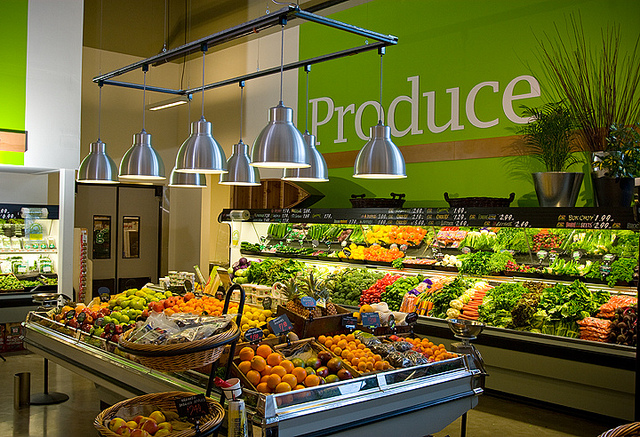 Produce section within Supermarket, fruit and vegetables on a display
