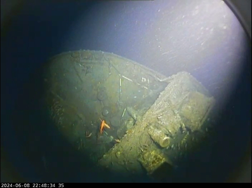Underwater camera view of the stern of a shipwreck.