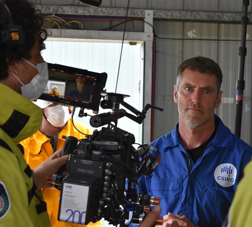 CSIRO Principal Experimental Scientist Mr Justin Leonard conducting live burn-over experiments with fire agencies that were filmed at the NSW Rural Fire Service Hot Test Fire Facility at Mogo in New South Wales (NSW). 