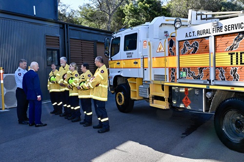 King Charles speaks with members of the Tidbinbilla volunteer brigade.