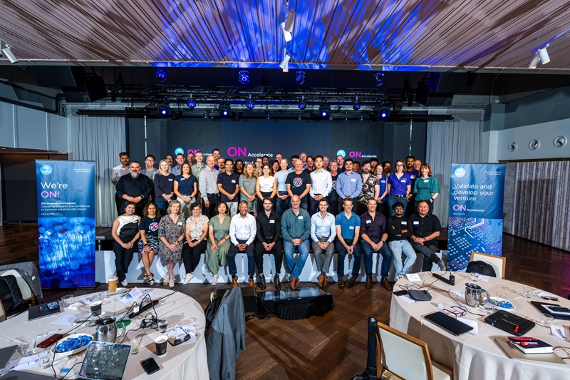  Attendees of an event gathered for a group photo, representing various backgrounds and fostering a spirit of teamwork.