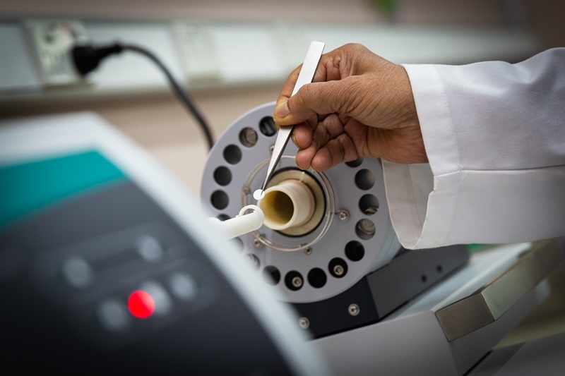 Close up photo of a cylindrical object in a laboratory setting. 