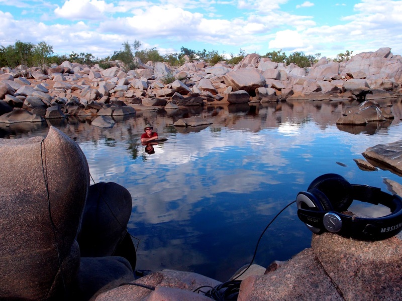 CSIRO bioacoustics expert Dr Simon Linke takes a swim in a billabong while recording waterbugs in far north Queensland.