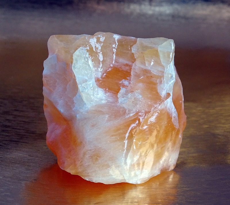 a squarish piece of orange and white crystal