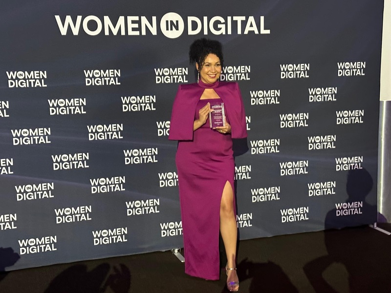 Louisa holding her award at the Women in Digital Awards event