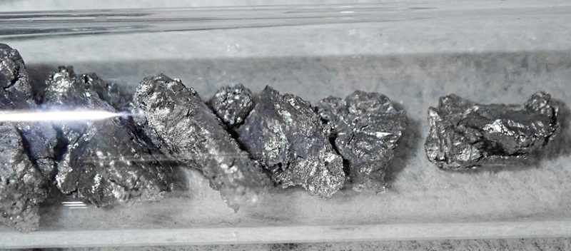 silvery metal pieces in test tube