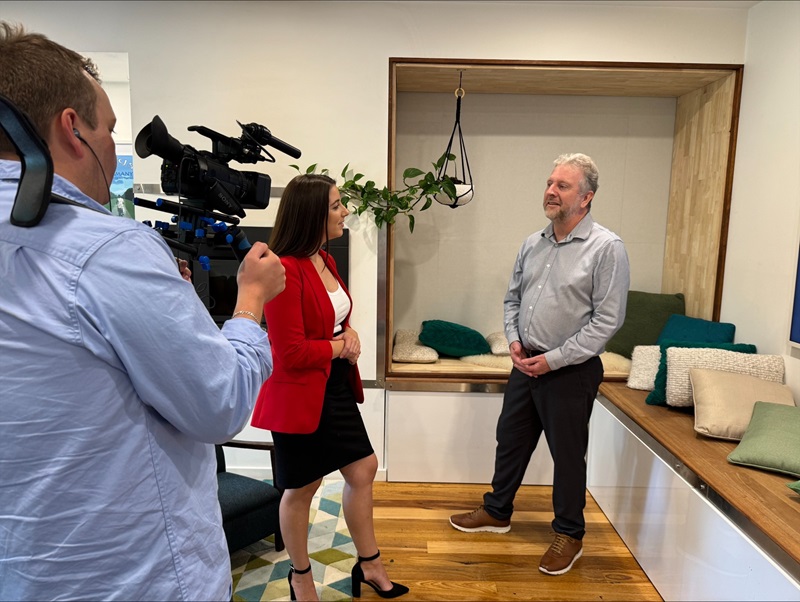 Women speaking with a man will being filmed for a reality TV show 